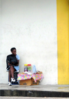 Trinidad - Port of Spain:street vendor - white wall - photo by P.Baldwin