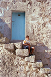 Turkey - Belisirma / Peristrema (Nevsehir province): boy sitting on stairs - village rupestre - photo by J.Kaman