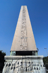 Istanbul, Turkey: Egyptian obelisk in the hippodrome - the base shows a relief from the old Constantinople - Eminn District - photo by M.Torres