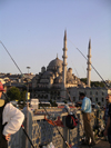 Turkey - Istanbul / Constantinople / IST: fishermen and the 'new' mosque / Yeni Cami / Yeni Valide - Eminonu waterfront - photo by R.Wallace