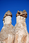 Cappadocia - Greme, Nevsehir province, Central Anatolia, Turkey: fairy chimneys - hard rocks resting on cone-shaped pinnacles - Valley of the Monks - Pasabagi Valley- photo by W.Allgwer