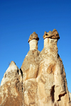 Cappadocia - Greme, Nevsehir province, Central Anatolia, Turkey: rock formation - basalt boulders over tuff cones - fairy chimneys - Valley of the Monks - Pasabagi Valley- photo by W.Allgwer