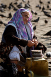 Istanbul, Turkey: old woman selling bird feed outside Istanbul university - Beyazit square - photo by J.Wreford