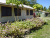 Funafuti atoll, Tuvalu: houses with flowers, papaya trees and rain water collection system - photo by G.Frysinger