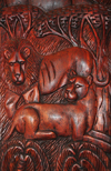 Entebbe, Wakiso District, Uganda: wood bas-relief displaying a lion and lioness resting in the African savannah under acacia trees - photo by M.Torres