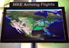 Milwaukee, Wisconsin, USA: General Mitchell International Airport - screen displaying real time positions of arriving flights on a map of North America - MKE- photo by M.Torres