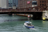 Chicago, Illinois, USA: Chicago River - the Ikanakya motor boat heads under the Clark Street Bridge - photo by C.Lovell