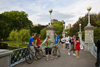 Boston, Massachusetts, USA: bicyclists on the suspension bridge in the Boston Common - photo by C.Lovell