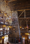 Yellowstone National Park, Wyoming, USA: stone fireplace of the log built interior of the historic Old Faithful Inn - completed in 1904 - photo by C.Lovell