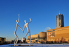 Denver, Colorado, USA: Denver Performing Arts Complex - DPAC - houses the Ellie Caulkins Opera House, the Buell Theatre and the Boettcher Concert Hall - Four Seasons tower in the background and in the foreground the Sculpture Park, 'Dancers' by Jonathan Borofsky - photo by M.Torres