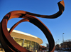 Denver, Colorado, USA: Colorado Convention Center - 'Indeterminate line' by Bernar Venet - Cor-Ten coil sculpture by the Wells Fargo Theatre - Speer Blvd - photo by M.Torres