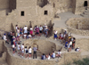 Mesa Verde National Park, Montezuma County, Colorado, USA: a Ranger speaks to visitors around a kiva at Cliff Palace - photo by C.Lovell