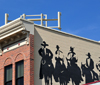 Golden, Jefferson County, Colorado, USA: cowboys on the side of building - mural on Ford Street - photo by M.Torres