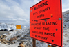 Loveland pass, Colorado, USA: long range cannons are used for avalanche blasting - warning sign - photo by M.Torres