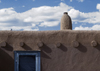Pueblo de Taos, New Mexico, USA: architectural details - blue door and chimney - photo by C.Lovell