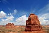 Arches National Park, Utah, USA: Courthouse Towers - butte with the Organ fin in the background - blue sky with cumulus clouds - photo by M.Torres