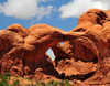 Arches National Park, Utah, USA: double arch - natural sandstone arches - pothole arch, formed by water erosion from above - photo by M.Torres