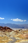 Death Valley National Park, California, USA: Zabriskie Point - view towards Gower Gulch - the flat salt plains on the valley floor and the Panamint Range are visible in the distance - photo by M.Torres