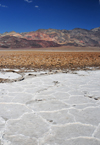 Death Valley National Park, California, USA: Badwater Basin dry lake - salt flats - pattern defined by salt ridges - Amargosa range - photo by M.Torres