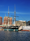 Baltimore, Maryland, USA: sloop-of-war USS Constellation with the buildings of Pratt Street in the background - photo by M.Torres