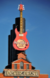 Baltimore, Maryland, USA: Hard Rock Cafe electric guitar and the original smoke stacks of the old Power Plant - photo by M.Torres