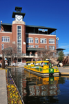 Oklahoma City, OK, USA: Bricktown - water taxi in the Bricktown Canal - JDM Place clock tower - photo by M.Torres