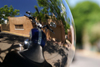 Santa F, New Mexico, USA: motorcycle and adobe house, reflection in a helmet - photo by A.Ferrari