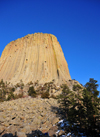 Devils Tower National Monument, Wyoming: seen from below - the elements continue to erode the sedimentary rocks around the base - start of the trail - Crook County - photo by M.Torres