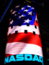Manhattan (New York City): Times Square - NASDAQ electronic stock market - NASDAQ MarketSite LED video display - corner of Broadway and 43rd Street - US flag - photo by M.Bergsma