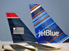 Charlotte, North Carolina, USA: aircraft tails,JetBlue and US Airways, Charlotte Douglas International Airport - photo by M.Torres