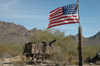 USA - Tombstone, Arizona - O.K. Corral film set - Old Tucson - US Army wagon with gatling gun - American flag - Photo by K.Osborn