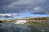 Niagara Falls, New York, USA: rainbow over the Niagara River - American Falls, Rainbow Bridge and Prospect Point Park observation tower - Goat Island scarp and Lady of the Mist boats - photo by M.Torres