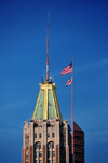 Baltimore, Maryland, USA: top of the Bank of America building and needle with flags of the William Donald Schaefer Building - photo by M.Torres