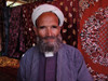 Uzbekistan - Samarkand / Samarqand / Samarcanda / SKD : traditional clothes - Uzbetk man at the bazaar (photo by Alejandro Slobodianik)
