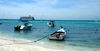 Los Roques, Venezuela: Isla Madrizqui - beach, boats and cruise liner - photo by R.Ziff