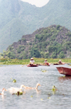 Hue: boats on the Huong River - the Perfumed river - photo by N.Cabana