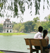 Hanoi - vietnam - Hoan Kiem Lake - couple on a bench - photo by Tran Thai