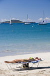 Tortola: Cane Garden Bay, BVI: Caribbean relaxation - woman sunbathing - photo by D.Smith