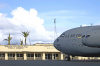 Wake island: a C-17 Globemaster III sits in front of the airfield operations building - motto 'Where America's Day Really Begins' - photo by USAF / Tech. Sgt. Shane A. Cuomo