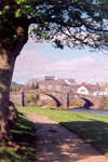 Wales - Llanwryst / Llanwrst: picturesque arched stone bridge 'Pont Fawr' - commisioned by the Wynn family, owners of Gwydir Castle - summer in the shade - Conwy valley - Conwy river - photo by A.Baptista