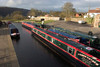 Llangollen, Denbighshire / Sir Ddinbych, Wales, UK: canal longboats lined up - Golden Meadow - photo by I.Middleton