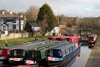 Llangollen, Denbighshire / Sir Ddinbych, Wales, UK: canal longboats lined up - Llangollen canal is used for warter supply and leisure boats - photo by I.Middleton