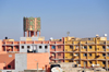 Layoune / El Aaiun, Saguia el-Hamra, Western Sahara: sky line - apartment blocks and water tower - photo by M.Torres