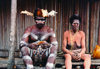 West Papua / Irian Jaya - Owus village: tribal couple - porch of the long house - photo by G.Frysinger