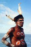 West Papua / Irian Jaya - Owus village: Asmant tribal man with elaborate hat - by the sea - photo by G.Frysinger