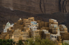 Wadi Hadhramaut, Hadhramaut Governorate, Yemen: traditional village - mud towers and cliff face - photo by J.Pemberton