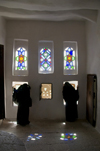 Wadi Dhahr, Al-Mahwit Governorate, Yemen: women looking out the windows of Dar al-Hajar Palace - stained-glass takhrim windows - photo by J.Pemberton