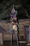 Victoria Falls - Mosi-oa-tunya, Matabeleland North province, Zimbabwe: striped Shana tribal dancer on stilts, part of a native drama - photo by C.Lovell