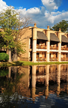 Victoria Falls, Matabeleland North, Zimbabwe: Kingdom Hotel - The Kingdom At Victoria Falls - pond side rooms - baobab trees - the architecture on the ancient Kingdom of Munhumutapa - photo by M.Torres