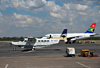 Victoria Falls, Matabeleland North, Zimbabwe: Victoria Falls Airport - Solenta Aviation Cessna 208B Grand Caravan ZS-SLO cn 208B0485 and South African Airways Airbus A319,  ZS-SFG cn 2326 - photo by M.Torres